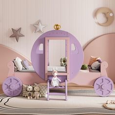 a child's bedroom decorated in pink and purple