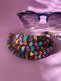 The perfect accessory for your wardrobe, adding a finishing touch to your outfit. Multi-functional glasses, sunglasses and mask chain holder with multi-colored beads. It can also be used as a necklace. Thank you in advance for choosing my designbycolla store. If you have a question, I can answer immediately. My three-functional product, which can be eyeglass chain, necklace, bracelet, is completely made with the help of handmade crochet. This eyeglass chain can be a very perfect choice for your Trendy Multicolor Glasses Chains, Handmade Glasses Chains For Summer Party, Adjustable Multicolor Glasses Chains For Festivals, Trendy Handmade Beaded Necklaces For Parties, Multicolor Glasses Chains For Summer Parties, Multicolor Bohemian Glasses Chains For Summer, Bohemian Multicolor Glasses Chains For Summer, Handmade Summer Party Glasses Chains, Multicolor Summer Party Glasses Chain