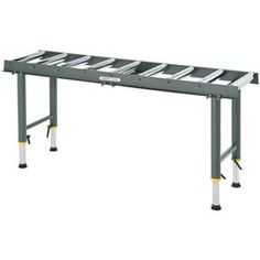 a long metal table with two legs on each side and one leg raised up to the ground