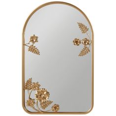 a mirror with gold flowers and leaves on it