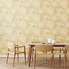 a dining room table with chairs and a vase on top of it next to a wall