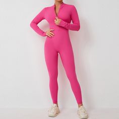 Elevate your fitness wardrobe with the Zipper Workout Romper. This Padded Bodysuit, designed for women who embrace high-intensity workouts and seek stylish comfort. Crafted from a premium blend of nylon and spandex, this long-sleeved gym jumpsuit offers a snug, supportive fit that moves with you. The elastic waist ensures a secure fit, while the padded interior and 4-way stretch fabric provide maximum comfort and flexibility. Key Features: Material: High-quality nylon and spandex blend for durab High Stretch Unitard For Gym, High Stretch Nylon Unitard For Athleisure, High Stretch Nylon Unitard For Sports, Compression Long Sleeve Bodysuit For Workout, Compression Long Sleeve Unitard For Workout, Long Sleeve Compression Unitard For Workout, Compressive Nylon Unitard For Workout, Sporty Nylon Unitard For Sports, Sportswear Long Sleeve Jumpsuits And Rompers For Sports