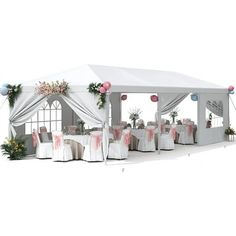 a white tent set up with tables and chairs