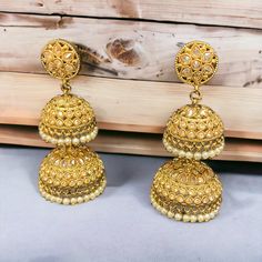 The Vanisha double layer jhumka are lightweight jhumkas with Pearls, American Diamond crystals with Gold-Plating. Specifications Materials used: American Diamond crystals, Pearls, Gold Plating At Romikas, we pride ourselves on the craftsmanship and high quality of our jewelry, designed to enhance your natural beauty. Please contact us with any questions. Cheap Gold Dangle Jhumkas, Luxury Heavy Gold Chandbalis, Jhumka Designs, Traditional Earrings, American Diamond, Diamond Crystal, Gold Plating, Double Layer, Jewelry Set