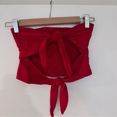 Tie Front Tube Top Never Worn Red Size M Red Crop Top For Summer, Red Summer Top For Day Out, Red Tops For Summer Day Out, Red Cotton Beach Crop Top, Fitted Red Crop Top For Beach, Red Cotton Crop Top For Beach, Chic Red Crop Top For Vacation, Trendy Red Crop Top For Summer, Chic Red Top For Beach