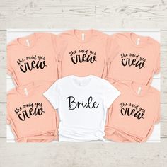 six bride shirts with the words, she made me crew and her name on them