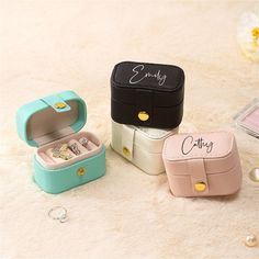 Protect your precious jewels with a personal touch.  Designed for travel or gifting, our mini jewelry box is not just a container but a cherished keepsake. Whether for a loved one or bridesmaid, it’s an elegant way to show your gratitude and celebrate the meaningful connections you hold dear.  This dainty box, cloaked in luxurious PU leather and lined with velvet, ensures your jewelry stays free from dust, abrasions, and scratches. It features five secure slot rolls, providing a sanctuary for ri Stud Earring Storage, Portable Jewelry Organizer, Mini Ring, Úložný Box, Earring Storage, Leather Jewelry Box, White Jewelry Box, Earring Organizer, Simple Leather