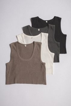 A 100% cotton rib tank with a vintage-inspired, cropped raw-edge hemline. Garment washed for a vintage feel. Perfect for layering or on its own. Your call. 100% ORGANIC COTTON 5 OZ SOFT RIB CROP FIT RAW EDGE SINGLE STITCHED Elwood Clothing, Black Rib, Season Colors, Vintage Silk, Raw Edge, Crop Tank, Clothing Brand, Vintage Inspired, Vintage Outfits