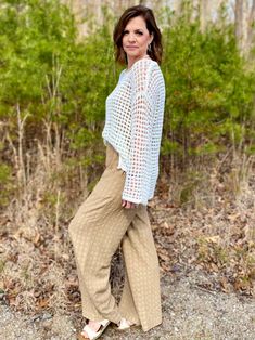 Make a splash with our Let's Go to the Beach Sheer Crochet Pullover! With its boat neck, drop shoulder, and long sleeves, this sheer crochet knit sweater is perfect for any beach day. Its great versatility allows for it to be worn as a swimsuit coverup or a stylish pullover. This is designed to be oversized, so you could size down if needed. I am in the small. Sizes: Small-Large 65% Acrylic, 35% Nylon Crochet Knit Sweater, Crochet Pullover, Go To The Beach, Queen Dress, Dress Gift, Boat Neck, Beach Day, Graphic Shirts, Drop Shoulder