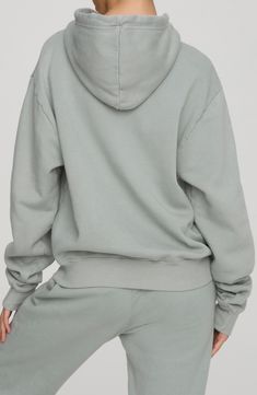 This cotton-knit hoodie offers plush comfort with an oversized fit that covers your backside and extra long sleeves. 27 1/2" length (size 5) Attached hood with drawstring Long sleeves Kangaroo pocket Ribbed accents Allover print 100% cotton Machine wash, tumble dry Made in USA Model stats: 5'10" height, 32" bust, 25" waist, 36" hip. Model is wearing size 5 Spring Drop Shoulder Hoodie With Drawstring Hood, French Terry Loungewear Hoodie, Comfortable Long-sleeve Hoodie With Drawstring Hood, Comfortable Loungewear Hoodie With Drawstring, Relaxed Fit Hoodie With Drawstring For Loungewear, Oversized Cozy Hoodie With Drawstring, Comfortable Long Sleeve Hoodie With Drawstring, Cozy Oversized Hoodie With Drawstring, Spring Hoodie With Drop Shoulder And Ribbed Cuffs