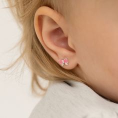 These bubble gum pink enamel bow earrings are sweet and lovely for little girls. Cubic zirconia adds a fun sparkle to the silver bow earrings and the 925 sterling silver makes this pair hypoallergenic and safe for sensitive ears. They feature threaded posts and a safety back system to ensure your child's earrings stay comfortably in place. Complimentary gift box is included for easy gift giving! Bubble Gum Pink, Thread Earrings, Kids Earrings, Kids Necklace, Earring Post, Silver Bow, Pink Enamel, Bow Earrings, Girls Earrings