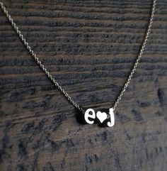 Personalized letter necklace- Couples Initials Necklace, Tiny letter necklace, Couples necklace, Gift for girlfriend, Valentine's Day Gift, Minimal Necklace, personalized necklaceFeatures:--------------- rhodium plated charms (hearts and letters)- lowercase block letters- sterling silver chainPersonalize this adorable necklace with you and your loved one's initials.  Pick the 2 initials from the drop down menu and let me know the length of the chain, up to 19 inches at no additional cost.Dimensi Initial Pendant Name Necklace For Anniversary Gift, Name Initial Pendant Necklaces For Anniversary Gift, Name Initial Pendant Necklace For Anniversary Gift, Personalized Couples Necklaces For Mother's Day, Personalized Initial Pendant Necklace For Valentine's Day, Silver Nameplate Initial Necklace For Anniversary, Couples Heart Necklace For Gift, Couples Heart-shaped Necklace For Gift, Meaningful Charm Necklaces For Valentine's Day Gift