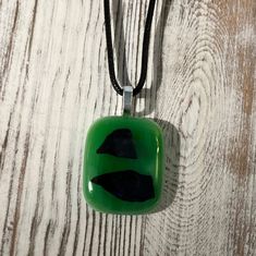 This pendant is a mixture of dark green, light green, and black confetti glass. The price includes a 16 inch black cord necklace. Black Confetti, Black Cord Necklace, Black Necklace, Cord Necklace, Green And Black, Green Light, Pendant Necklaces, Confetti, Light Green