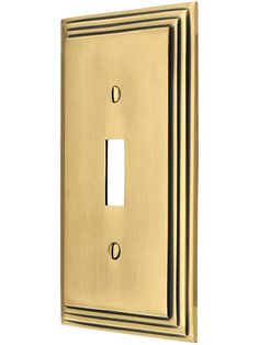 a single light switch cover in brass