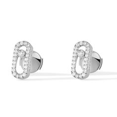 With an elegant and pared down style, these 18k white gold pave diamond earrings set with a brilliant cut diamond are part of the Move jewelry for women collection. Easy to wear everyday in white gold, these diamond earrings suit to any style, from the most casual to the sophisticated ones. This pair of Move Uno white gold diamond stud earrings will become your day to day fetish jewel. Diamonds are 1/5ctw, G in color, and VS in clarity. Messika Style #: 05634-WG Messika Move Uno, White Gold Diamond Earrings, Pave Diamond Earrings, Gold Diamond Earrings Studs, Gold Diamond Studs, White Gold Earrings Studs, Sparkly Earrings, Gold Diamond Earrings, White Gold Earrings