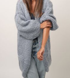 This long cardigan is handknitted with premium quality Kid Mohair. A luxury yarn made out of 80% kid mohair; 10% Lana merino extra fine; 10% Polyamide. Very light and fluffy feeling. Designed to flatter all silhouettes with its wide oversized fit. Perfect for casual, dating, office, going out, party and formal events.  Available in different colors - please visit my Etsy shop. SIZE & FIT One size fit (XS - L) / EUR (34-40) / US (4-10) / CANADA (6-12) / UK (8-14) Wide fit, open front Ribbed wrist Winter Mohair Cardigan With Soft Texture, Winter Mohair Cardigan, Mohair Cardigan With Soft Texture For Winter, Hand Knitted Mohair Cardigan For Winter, Cozy Hand Knitted Mohair Cardigan, Handmade Mohair Cozy Cardigan, Cozy Mohair Sweater Coat With Chunky Knit, Oversized Hand Knitted Mohair Cardigan, Mohair Chunky Knit Cozy Sweater Coat