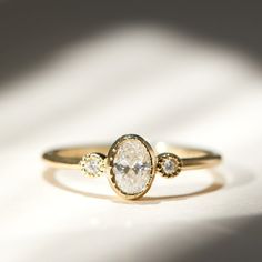 a close up of a ring on a white surface