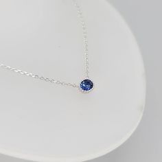 Inspired by Princess Diana’s engagement ring, the Diana Sapphire Necklace boasts a bold, beautiful blue hue uncommon among natural sapphires. Dimensions:Chain length: 40 cm, adjustable up to 42 cm (approx. 15.7 to 16.5 in)Pendant: 6 mm x 5 mm Materials used (pictured):14K solid white gold, 1.73 g1 x natural blue sapphire (heated), 0.45 ct (5 mm x 4 mm) Note: Only the White Gold option is Ready to Ship. Other options can be ordered but standard delivery times apply. Formal Sapphire Round Pendant Necklace, White Gold Sapphire Round Pendant Necklace, White Gold Necklace With Birthstone And Lab-created Sapphire, White Gold Necklace With Lab-created Sapphire Birthstone, Sapphire Fine Jewelry Birthstone Necklace, Sapphire Birthstone Necklace In Lab-created Sapphire, Sapphire Birthstone Necklace In Sterling Silver, White Gold Sapphire Necklace Round Cut, White Gold Sapphire Round Cut Necklace