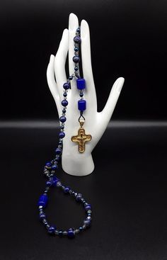 Blue Cross Spiritual Necklace, Spiritual Blue Cross Pendant Necklace, Spiritual Healing Jewelry With Miraculous Medal, Healing Jewelry With Miraculous Medal And Round Beads, Blue Cross Spiritual Jewelry, Blue Spiritual Cross Jewelry, Spiritual Crucifix Jewelry With 8mm Beads, Blue Crucifix Necklace For Spiritual Wear, Blue Crucifix Necklace For Spiritual Purposes