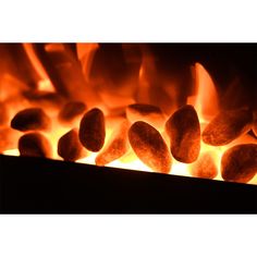 hot coals in an open fire with bright orange flames coming from the top and bottom