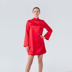 "A modern qipao dress featuring a loose silhouette, mini length and a high neck collar. - modern cheongsam style - mandarin neck - loose silhouette - above the knee length (mini) - loose long sleeves - back metal zipper closure - lined bodice Color: red Fiber: viscose - 40%, elastane - 5%, polyester - 55% Lining: viscose - 95 %, elastane - 5% For Size S: dress length - 33,5\"(85 cm), sleeve length - 23,6\" (60 cm) Our model wears size S (US 6) and is 171cm/5'7\" tall. MORE DRESSES: https://www.e Spring Evening Dress With High Neck, Spring Evening High Neck Dress, High Neck Long Sleeve Dress For Spring Party, High Neck Cocktail Dress For Spring, Elegant High Neck Long Sleeve Dress For Spring, Spring Party High Neck Long Sleeve Dress, Winter Cocktail Dress With High Neck, High Neck Mini Dress For Cocktail In Fall, Elegant Midi Dress With Stand Collar For Evening