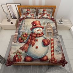 a bed with a snowman and candy canes on it