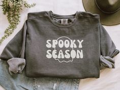 Get into the spirit of the season with our Spooky Season Crewneck for Fall. This cozy comfort colors sweatshirt is the perfect choice to embrace the festive vibes of Halloween and autumn. It's an ideal gift for her or him, and a must-have addition to your fall wardrobe. Crafted with care and designed for comfort, this crewneck sweatshirt offers a relaxed fit that is perfect for cozy days and chilly evenings. Made with high-quality materials, it ensures durability and softness, providing a comfortable and snug feel. Celebrate the spooktacular season with our festive Halloween design. The unique print captures the essence of Halloween with whimsical motifs, including pumpkins, bats, and ghosts. It adds a touch of fun and flair to your outfit, making you ready for all the Halloween festivitie Easy Halloween Designs, Sage Design, Halloween Hoodies, Comfort Colors Sweatshirt, Halloween Hoodie, Unique Halloween, Halloween Festival, Fall Shirt