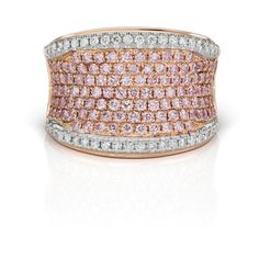 This enchanting ring showcases a pair of brilliant round Argyle pink diamonds, totaling 1.17 carats, nestled within a precious 18KT pink gold setting. These rare and exquisite Argyle pink diamonds are perfectly complemented by 0.45 carats of brilliant round white diamonds, adding a captivating sparkle to the design on Pink Diamond Cut Diamond Ring, Luxury Pink Rings With Pave Setting, Luxury Pink Diamond Ring With Single Cut Diamonds, Pink Diamond Ring With Pave Setting, Fine Jewelry Pink Diamond Ring With Pave Setting, Luxury Pink Brilliant Cut Rings, Luxury Pink Rings With Brilliant Cut, Pink Diamond Rings With Diamond Cut, Pink Diamond Cut Fine Jewelry Ring