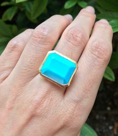 "A genuine large rectangular-shaped faceted Blue Turquoise, Robins Egg Blue Hue aka Sleeping Beauty, set on a minimalist bezel is a great statement/cocktail ring. Made to order in your choice of metal 14k Yellow Gold, Rose Gold or White Gold FINAL SALE Instagram Video ----------------- https://instagram.com/p/BiXzeTqlqIb/ https://instagram.com/p/Biuu4QnFZmJ/ https://instagram.com/p/BjstMbtlEEW/ Face measure 16mmx 18.7mm Shank width 3.5mm Sits off the finger 5.7mm ----> Please note there is an Formal 14k Gold Turquoise Blue Ring, Blue Rectangular Faceted Jewelry, Turquoise Emerald Cut Gemstone Jewelry, Blue Square Cut Gemstone Jewelry, Emerald Cut Turquoise Gemstone Jewelry, Blue 14k Gold Jewelry With Rectangular Stone, 14k Gold Jewelry With Blue Rectangular Stone, Rectangular Turquoise Gemstone Ring, Turquoise Gemstone Rings With Emerald Cut