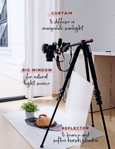 a tripod is sitting on top of a white mat