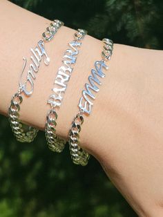 *WELCOME TO MY SilverChainDesing SHOP* Celebrate special moments with our Personalized Custom Name Bracelet. Crafted from premium Sterling Silver, this custom curb chain bracelet is designed for women and baby girls, offering a unique and stylish touch. Ideal as a birthday gift for moms or a special keepsake, this bracelet combines elegance with personal flair. Key Features: Material: Sterling Silver Design: Custom Name Curb Chain Bracelet Width: 5.40 mm Perfect For: Women, Baby Girls, Birthday Engraved Bangle Jewelry For Birthday, Dainty Customizable Silver Bracelet, Customizable Name Bracelet, Hypoallergenic Sterling Silver Bracelet For Mother's Day, Mother's Day Custom Name Charm Bracelet, Personalized Silver Bangle Chain Bracelet, Personalized Silver Chain Bracelet, Personalized Sterling Silver Name Bracelet, Personalized Silver Nameplate Jewelry