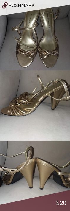 Bandolino gold bronze  sling  open toe heel 3 1/2" Gold and bronze sling back/strap open toe heel with twist/knot at the front. Perfect for a night on the town or fancy event. Item can be shipped in a shoebox upon request.  New never worn. Bandolino Shoes Heels Formal Slingback Pumps With Round Toe And Strap, Vintage Formal Sandals With 4-inch Heel, Strappy Slingback Pumps For Party With Heel Loop, Gold Strap Sandals For Evening, Formal Round Toe Slingback Pumps With Strap, Formal Strappy Slingback Pumps With Wrapped Heel, Strappy Slingback Pumps For Party, Gold Strappy Heels For Party, Gold Strap Heels For Party