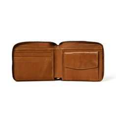 Adams Men's Leather Wallet comes in a perfectly sleek design that can carry your essentials securely. It is handcrafted from buffalo leather and features various card slots, cash sections, an ID compartment, and a coin pocket to keep your spare change. Salient Features Bi-fold design Spacious with multiple pockets for cards, coins and currency Leather Color - Tan Brown Material - Buffalo Leather Purely Handmade Eco-Friendly Zipper for 100% security of your essentials Size in Inch 4.5 L x 3.6 W i Classic Bifold Wallet With Zipper Closure, Leather Bifold Wallet With Coin Pocket, Leather Wallet With Coin Pocket For Everyday Use, Classic Leather Coin Purse With Zipper, Classic Leather Coin Purse With Zipper Closure, Leather Business Wallet With Coin Pocket, Business Leather Wallet With Coin Pocket, Classic Leather Trifold Wallet With Zipper For Everyday Use, Brown Wallets With Rfid Blocking For Everyday Carry