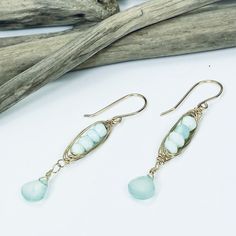 Our Seascape Stack earrings are the perfect beachy accessory for adding a pop of color to your wardrobe. Faceted Peruvian Opal and Chalcedony gemstones boast gorgeous sea green colors and are accented with 14k gold filled wire wrapping. Length: 2" Peruvian Opal and Chalcedony 14k gold filled Stack Earrings, Sea Green Color, Stacked Earrings, Peruvian Opal, Jewelry Repair, Wire Earrings, Sea Green, Semi Precious Gemstones, Stone Jewelry