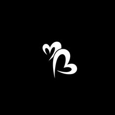 a black and white logo with two hearts in the shape of a snake, on a dark background