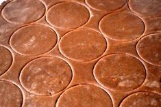 a chocolate cake with circles on it is ready to be cut into pieces and put in the oven