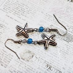 New! Beautiful Handmade Earrings Featuring Silver-Plated Starfish Charms And Blue Frosted Glass Beads. This Listing Is For One Pair Of Earrings. New To Poshmark? Use Referral Code Sharerw04 When You Sign Up To Receive Poshmark's Current Signup Offer (Typically $5-$10 Poshmark Credit!) Minnie Mouse Earrings, Crystal Heart Earrings, Diamond Shape Earrings, Gold Bar Earrings, Cameo Earrings, Elephant Earrings, Minimalist Studs, Clover Earrings, Heart Drop Earrings