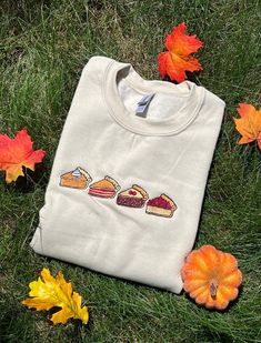 Get ready for fall with this cute embroidered sweatshirt! All sweatshirts are handmade and can be customized to your liking!  The sweatshirt is available in the color sand but can be made on other colors by request.  The sweatshirt is 50% cotton 50% polyester. The sweatshirt sizing does run small so if you are looking for a oversized/comfy fit please size up! Cheap Custom Embroidered Tops For Fall, Iron On Sweatshirt Ideas, Iron On Sweatshirt, Fall Pies, Sweatshirt Ideas, Orange Sweatshirt, Get Ready For Fall, Ready For Fall, Color Sand