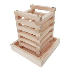 a stack of wooden crates sitting on top of each other in front of a white background