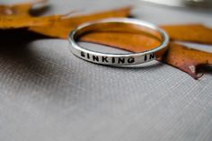 A solid sterling, personalized, stacking ring for every occasion - mother's gift, graduation, best friend ring, promise ring, anniversary, wedding or just because!   Words are powerful - what words do you want to keep close? You can have your words stamped on the inside and/or the outside - your choice. Want more than one? Here is the link to the money saving sets listing: https://boutonrougedesigns.etsy.com/listing/210312930 Prefer a gold version of this ring? See this listing: https://boutonro Everyday Meaningful Hand Stamped Stackable Rings, Meaningful Silver Stackable Rings, Meaningful Silver Stackable Rings Gift, Meaningful Stackable Sterling Silver Rings For Everyday, Meaningful Sterling Silver Stackable Rings For Everyday, Meaningful Everyday Sterling Silver Stackable Rings, Silver Stackable Rings For Gift, Meaningful Style, Everyday Sterling Silver Stackable Rings, Meaningful Stackable Promise Rings