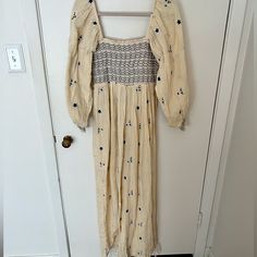 Size: S Color: Neutral Beige/Pale Yellow W Navy Detail Never Worn; Perfect Condition Spring Brunch Jumpsuits And Rompers With Smocked Bodice, Spring Jumpsuits And Rompers With Smocked Bodice For Brunch, Spring Relaxed Fit Jumpsuit With Smocked Back, Spring Cotton Jumpsuit With Smocked Bodice, Spring Cotton Jumpsuits And Rompers With Smocked Bodice, Bohemian Jumpsuits And Rompers With Smocked Back For Spring, Spring Jumpsuits And Rompers With Smocked Back, Spring Loungewear Dress With Smocked Bodice, Summer Smocked Long Sleeve Dress With Elastic Waistband