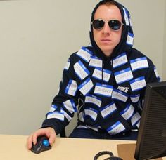 a man sitting at a desk in front of a computer