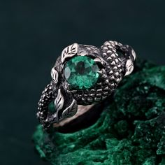 🌟 Warm Greetings, Jewelry Enthusiasts! 🌟 Step into a world where elegance meets personalization with our handcrafted silver rings. Each piece is a testament to unique artistry, blending mystical charm with modern finesse. Our collection offers a special touch for those who adore distinctive and thoughtfully designed jewelry. 🌈 Customization at Your Fingertips: Choose your perfect ring size and select from a variety of enchanting gemstones using our user-friendly dropdown menus. We delight in offering you the chance to create a ring that resonates with your personal style and story. ✨ Design It Your Way: Dreaming of a specific look? We're here to make it happen! Whether it's altering dimensions, adding extra gemstones, or choosing a different material, reach out to us. Your imagination i Green Snake Ring Gift, Green Snake Ring For Gift, Nature-inspired Round Emerald Ring, Sterling Silver Fantasy Ring, Unique Green Promise Ring, Mystical Green Rings Perfect For Gifts, Spiritual Emerald Rings, Nature-inspired Emerald Rings For Gift, Unique Emerald Ring As A Gift