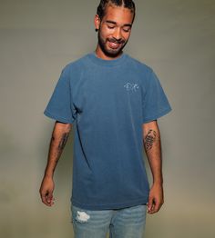 The Shop T-shirt by +Origami Raw+ is crafted from 100% cotton and garment-dyed for a vintage look and feel. Slightly oversized fit with plastisol ink screen printed on the front and back. Dayton is 6'0 and wears a size M. 7.5 oz 100% cotton Garment dyed Color: Denim True to size Hand stitched neck tag Hand Stitched, Vintage Look, Vintage Looks, Hand Stitching, Shirt Shop, Screen Printing, Origami, Screen, T Shirt