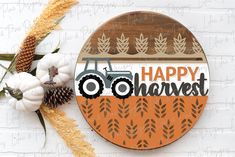 a sign that says happy harvest with a tractor