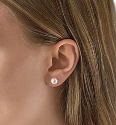 These freshwater pearl stud earrings are the perfect accessory to complement bold headpieces or heavily embellished dresses. For an ultra-polished look, go with a sculpted bun for your big day. Available in: .925 Sterling Silver Fresh Water Pearl, the shapes in natural pearls can vary Hypoallergenic post Available in: 8mm or 9mm pearl #E301 Diy Pearl Earrings, Embellished Dresses, Simple Pearl Earrings, Pearl Earrings Designs, Black Pearl Earrings, Earring Styles, Pear Earrings, Black Pearls, Simple Pearl