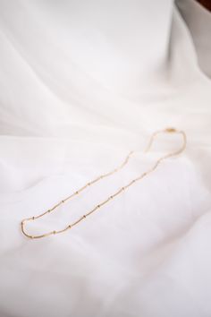 Satellite Chain necklace 18k gold plated stainless steel Hypoallergenic and Nickel Free Waterproof and Tarnish free! 18 inches in length Great for layering or wearing alone Staple piece The perfect everyday necklace! She is so dainty and easy to throw on with every outfit you could put together! We love her worn alone, and we also love her layered with other necklaces too! This piece is an ESSENTIAL piece every girl- of any age- needs in her wardrobe! Minimalist Snake Chain Charm Necklace For Everyday, Gold Hypoallergenic Charm Necklaces For Everyday, Everyday Gold Hypoallergenic Charm Necklaces, Minimalist 14k Gold Filled Chain Necklace As Gift, Everyday 14k Gold Filled Chain Choker, Everyday 14k Gold Filled Choker Necklace, Dainty Gold Hypoallergenic Necklace, Dainty Hypoallergenic Gold Necklace, Everyday Tarnish-resistant Snake Chain Charm Necklace