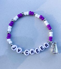 Cheer Bracelets  Create the perfect stack for you and your squad!  Customize with team colors, team name and megaphone 📣 *Please add colors and name in personalization section* CARING TIPS FOR YOUR JEWELRY ⭐️Treat and store with care. ⭐️ For longevity, avoid exposing your jewelry to water. ⭐️ Avoid having direct contact with lotions, perfumes, sanitizers as these chemicals may cause discoloration of your jewelry. Adjustable White Bracelets For Team Events, White School Spirit Jewelry As A Gift, White School Spirit Jewelry As Gift, School Spirit White Jewelry As Gift, White School Spirit Jewelry Gift, Cheer Team Mom, Cheer Bracelets, Cheer Jewelry, Team Bracelets