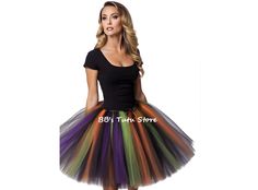 Get ready to cast a spell and embrace your inner witch with our custom-made Fluffy Witch Tutu Skirt. This enchanting skirt is perfect for creating your own unique costume and making a statement at Halloween parties, cosplay events, or any other occasion that calls for a touch of magic. Crafted with care, this tutu skirt is made by tying strips of tulle to a comfortable elastic band. The result is a voluminous and fluffy skirt that adds a whimsical and playful element to your outfit. The tulle strips are available in bewitching colors such as Black, Orange, Purple, and Green Apple, allowing you to create a spellbinding combination that suits your style. To complete the witchy look, this tutu skirt comes with a decorative satin black bow. The bow adds a touch of elegance and serves as a capt Fantasy Skirt For Halloween Costume Party, Fitted Fantasy Skirt For Costume Party, Witchy Skirt For Costume Party, Fantasy Costume Black Skirt, Fantasy Black Skirt For Costume, Gothic Skirt For Halloween Costume, Gothic Halloween Costume Skirt, Black Skirt For Halloween Costume Party, Halloween Party Fairy Grunge Skirt