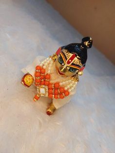 Necklace for laddu gopal.. Handmade Traditional Tikka For Festivals, Traditional Handmade Tikka For Festivals, Handmade Mala For Festivals And Gifts, Handmade Mala For Festivals As A Gift, Handmade Mala For Festivals Gift, Multicolor Temple Jewelry Mala For Puja, Handmade Mala For Navratri Gift, Spiritual Kundan Mala For Festivals, Multicolor Tikka For Puja Festivals